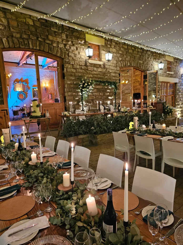 A wedding reception set up in a stone barn.